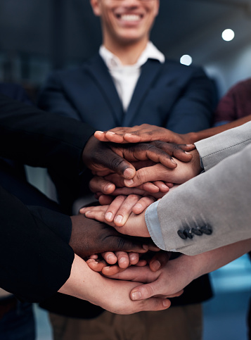 People Stacking Hands in Agreement
