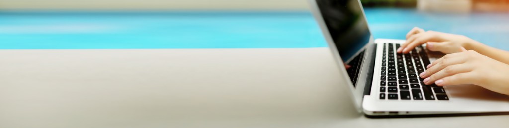 a person typing on a laptop